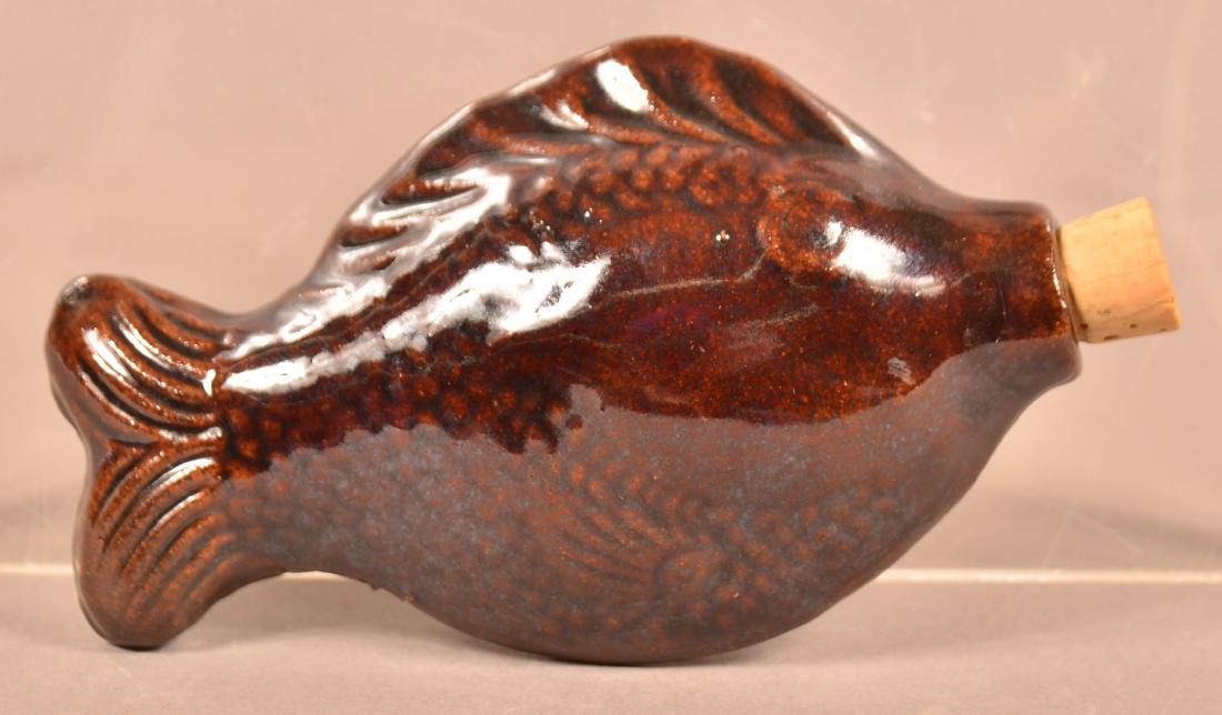 Brown Glaze Molded Earthenware Fish Form Small Flask. (1 of 2)