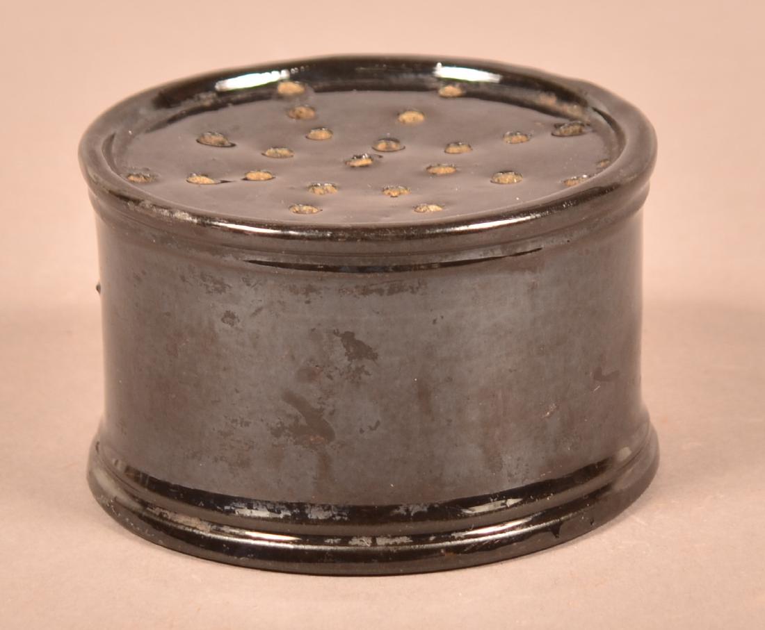 19th Century Manganese Redware Sander.: 19th Century Manganese Redware Sander. 3-1/2" diam. Condition: Large chip on base.