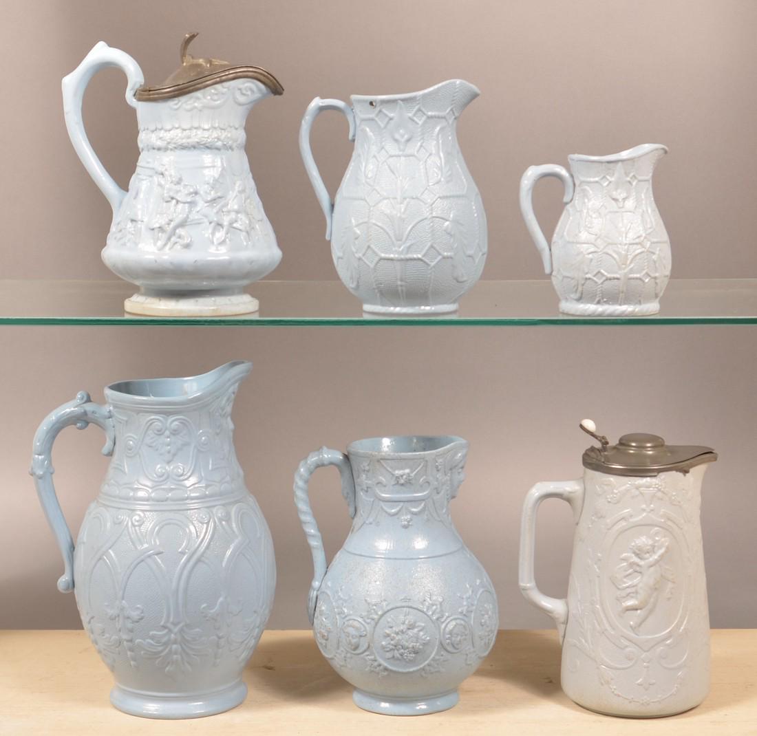 Six Pieces of English 19th Century Blue Parian.: Six Pieces of English 19th Century Blue Parian. Pitchers and jugs. Tallest measures 9-1/2"h. Condition: Very good overall, minor wear, smallest pitcher has a base line, one is missing cap.