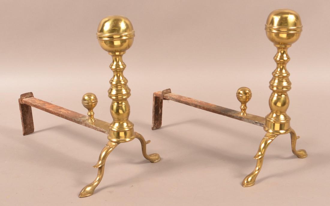 Pair of 19th Century Brass and Iron Andirons.: Pair of 19th Century Brass and Iron Andirons. 14-3/4"h. x 17"l. Condition: Good with minor dents and rust.