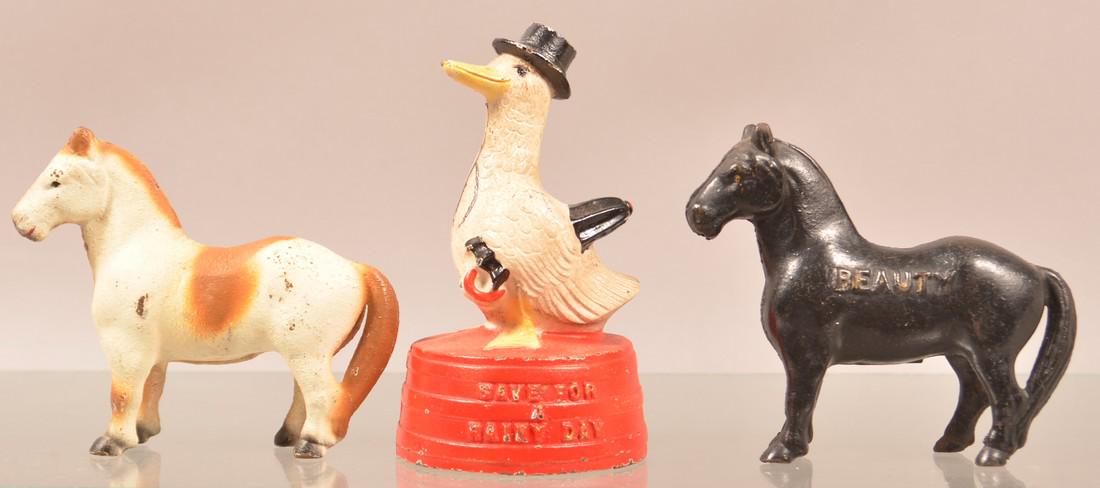Three Cast Metal Animal Figural Still Banks. (1 of 2)