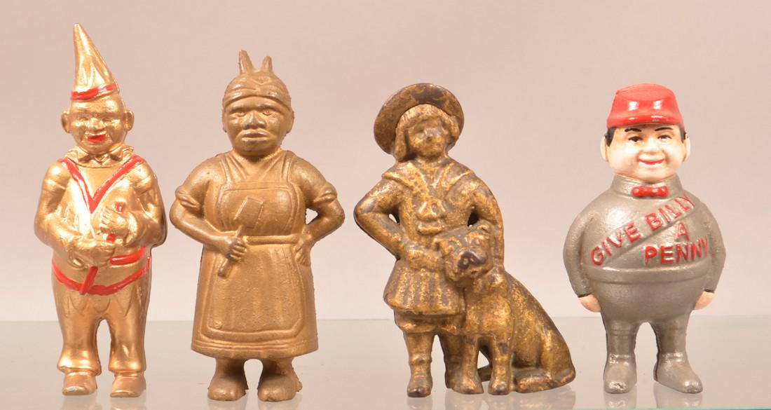 Four Cast Iron Figural Still Banks. (1 of 2)