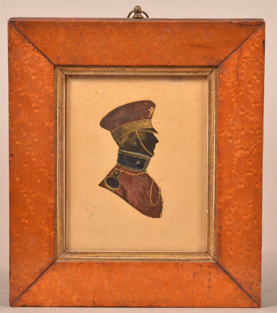 19th Century Hand Painted Silhouette.: 19th Century Hand Painted Silhouette. Shoulder length profile of a gent in military attire. In a period birds eye maple frame, 7-1/2" x 6-1/2" overall. Condition: Very good with some foxing.