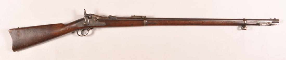 U.S. Springfield Model 1884 Trapdoor Rifle.: U.S. Springfield Model 1884 Trapdoor Rifle. With ramrod-bayonet. .45-.70 caliber, 32-5/8 in. barrel, 52" long overall. SN-318606. Trapdoor marked "US Model 1884", with later conversion to Model 1888. 