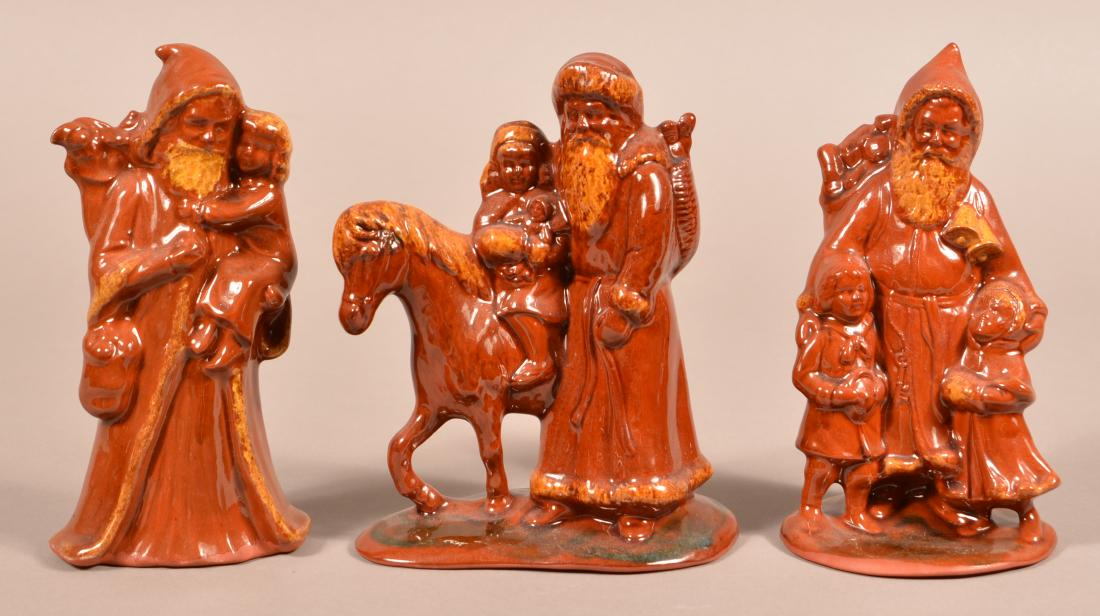 Three Foltz Redware Molded Santa Figures. (1 of 3)