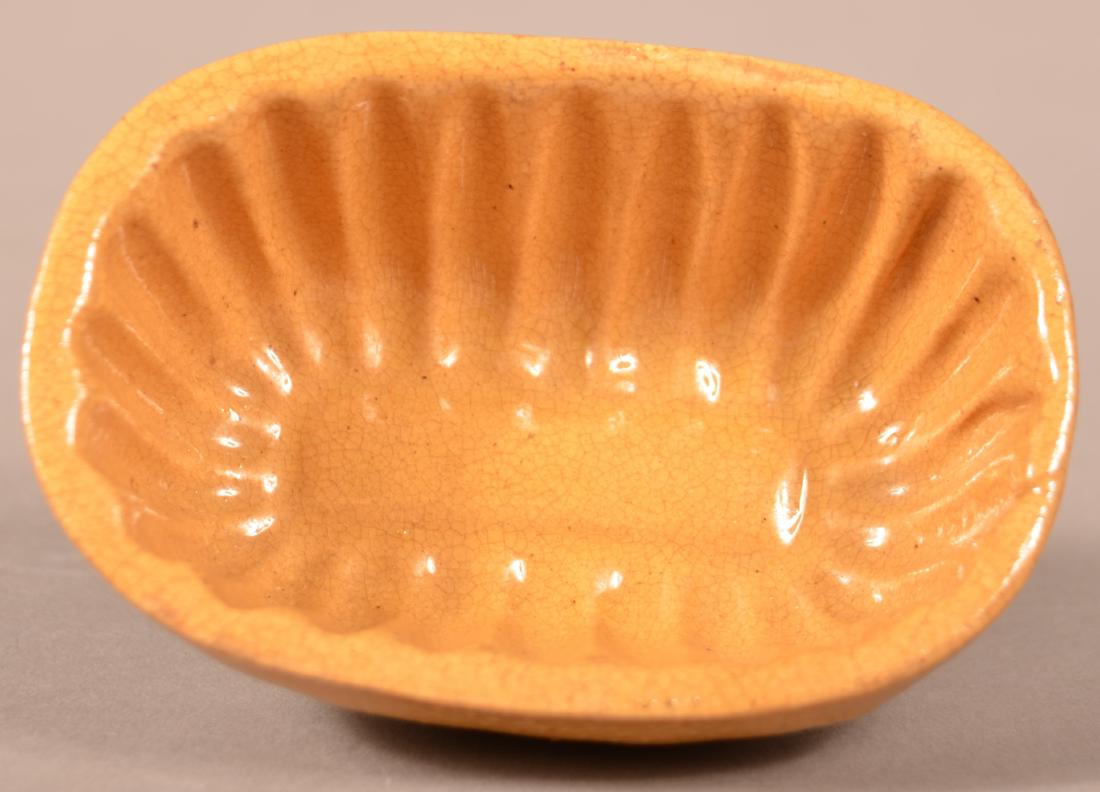 Signed Yellowware Oblong Mini-mini Mold. (1 of 3)