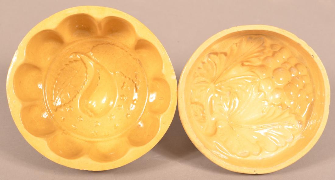 2 Antique Yellowware Round Molds. (1 of 3)