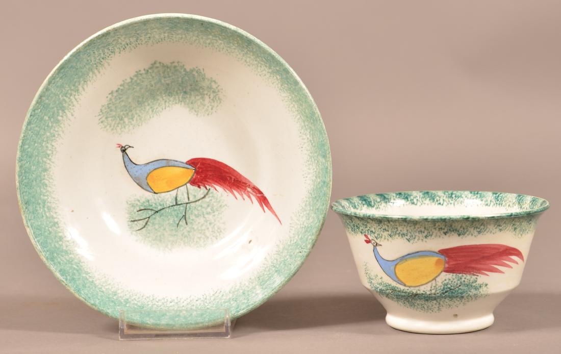 Green Spatter China Peafowl Cup and Saucer.: Green Spatter China Peafowl Cup and Saucer. Full green spatter field with blue, yellow and red peafowl. Saucer measures 5-3/4" diam. Condition: Cup has a hairline.