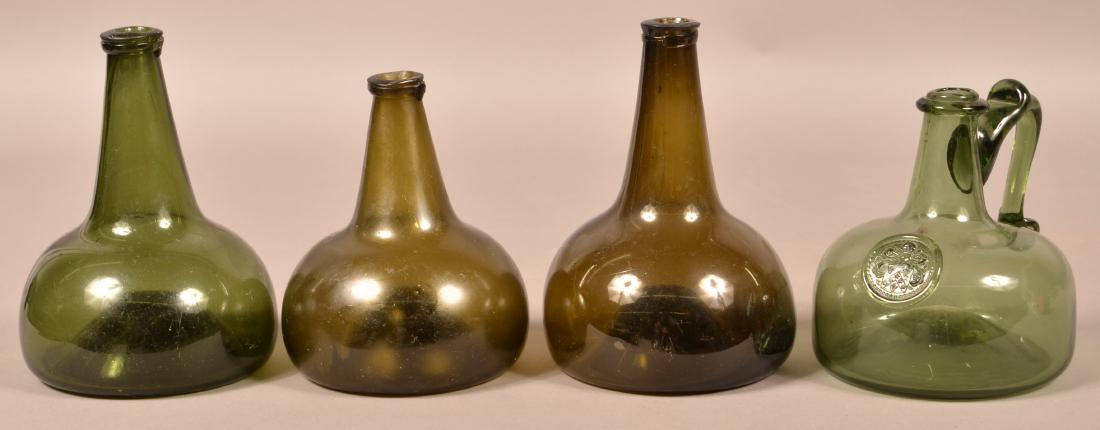 Four Various Emerald Green Squat Form Bottles. (1 of 3)