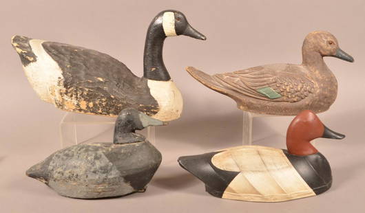 Four Various Decoys.: Four Various Decoys. Painted in natural colors. Paper mache, Canvas and carved wood. Canada goose measures 19"l. Condition: Good with wear and cracks.