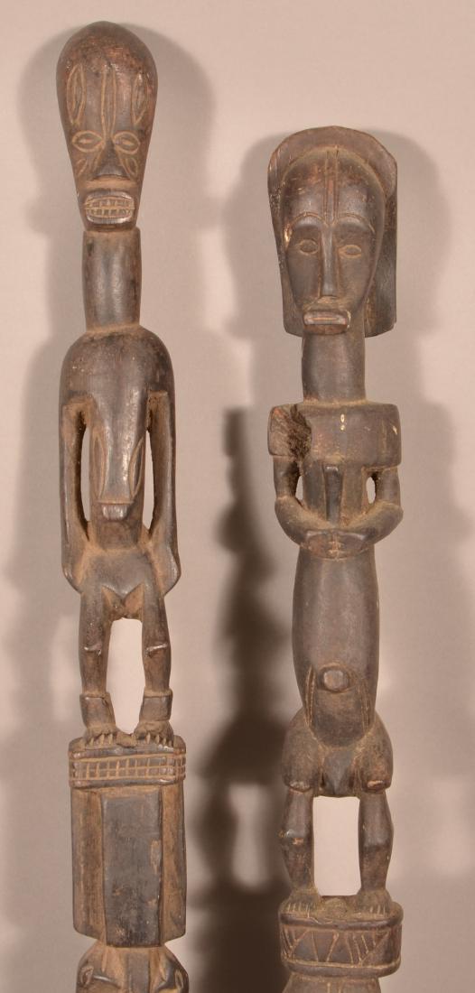 Two Antique/Vintage African Carved Wood Tribal Staffs.: Two Antique/Vintage African Carved Wood Tribal Staffs. Largest measures 55"h. Condition: Good with wear and age cracks.