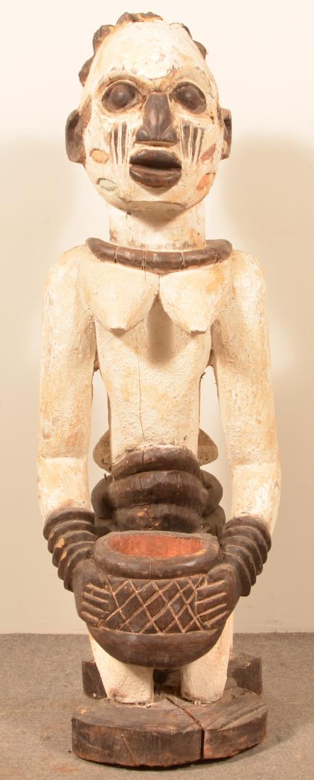 Antique/Vintage African Carved Wood Tribal Figure.: Antique/Vintage African Carved Wood Tribal Figure. Paint decoration 40"h. Condition: Good with wear, losses and age cracks.