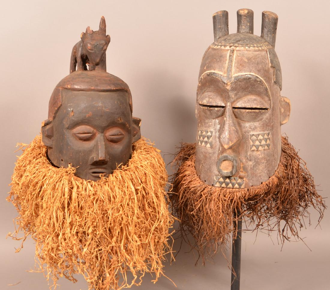 Two Antique/Vintage African Carved Wood Tribal Masks.: Two Antique/Vintage African Carved Wood Tribal Masks. Tallest measures 17"h. Condition: Good with wear, cracks and losses.