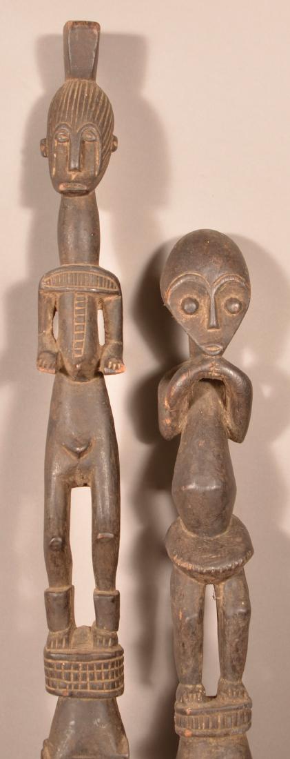 Two Antique/Vintage African Carved Wood Tribal Staffs.: Two Antique/Vintage African Carved Wood Tribal Staffs. Largest measures 55-1/2"h. Condition: Good with wear, cracks and losses.