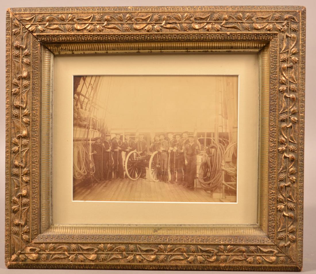 Late 19th Century Photograph of Sailors. Forming the: Late 19th Century Photograph of Sailors. Forming the Color Guard of the Flagship USS Tennessee. Onboard Ship next to a Gatling gun mounted on a field carriage. 7" x 9-1/4" Framed. Condition: Very good