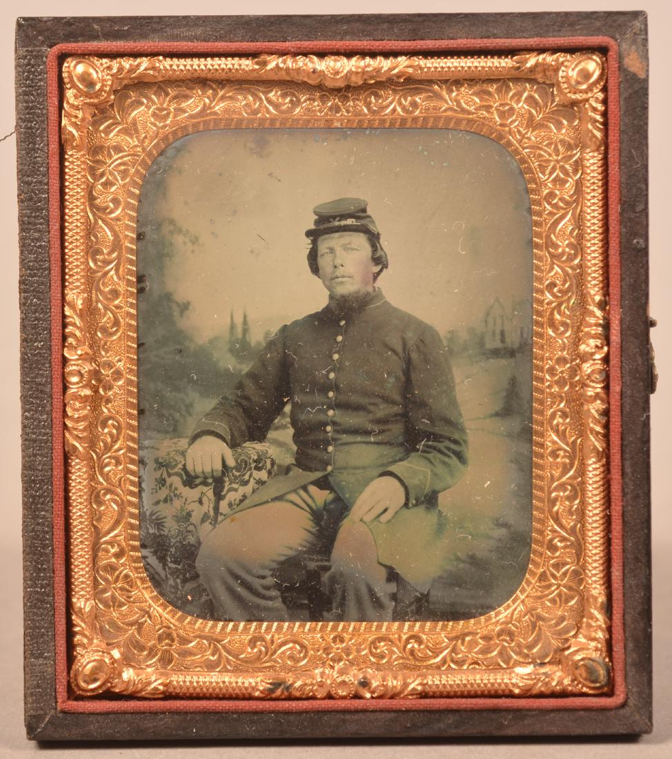1/6 Plate Ambrotype of a Civil War Soldier. Studio: 1/6 Plate Ambrotype of a Civil War Soldier. Studio seated pose in uniform. Condition: Good with wear. Partial case only.