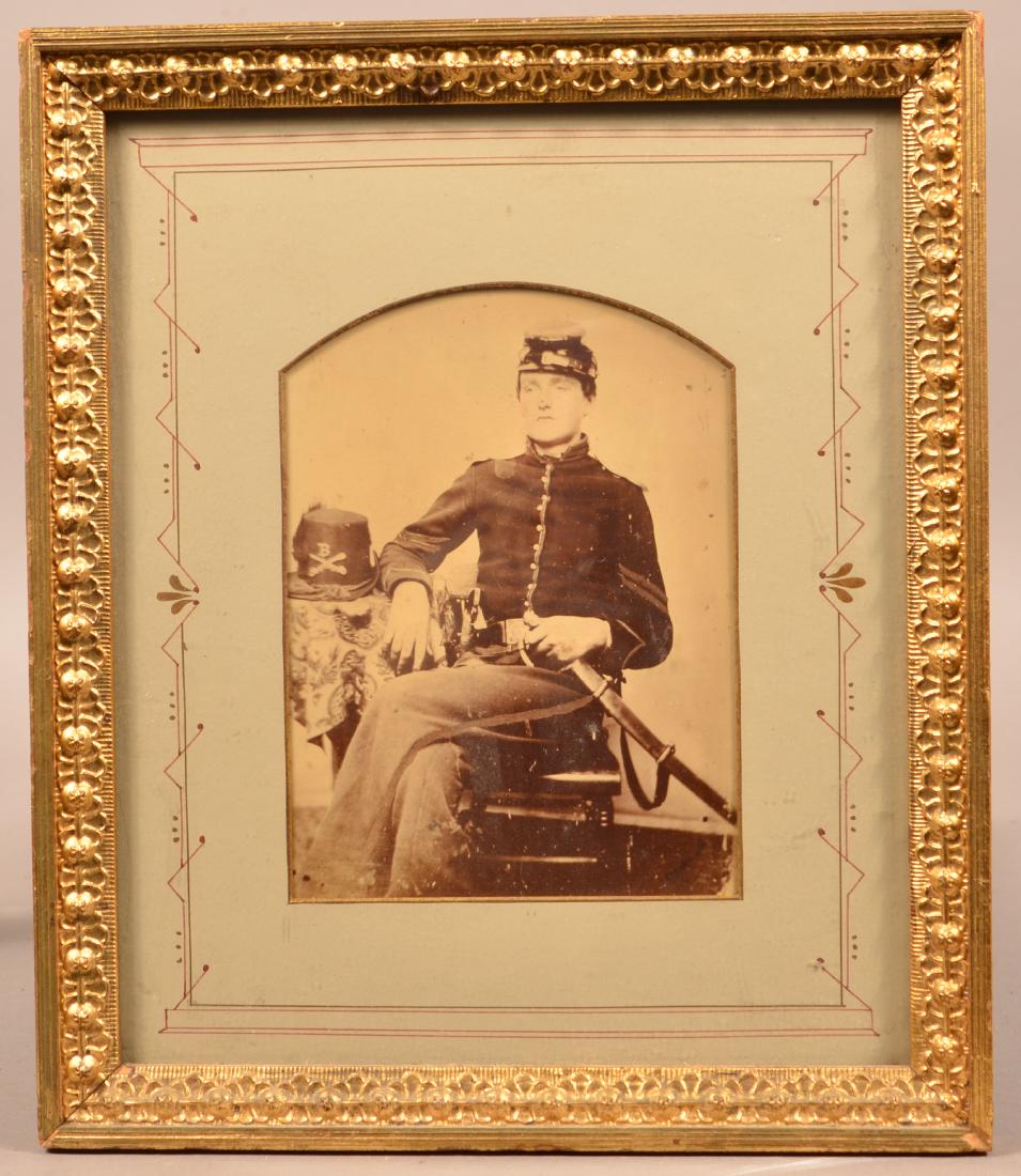 Photograph of a Civil War Corporal. With cavalry sword: Photograph of a Civil War Corporal. With cavalry sword and holstered revolver. Image 7-1/2" x 5-1/2". Framed. Condition: Very Good.