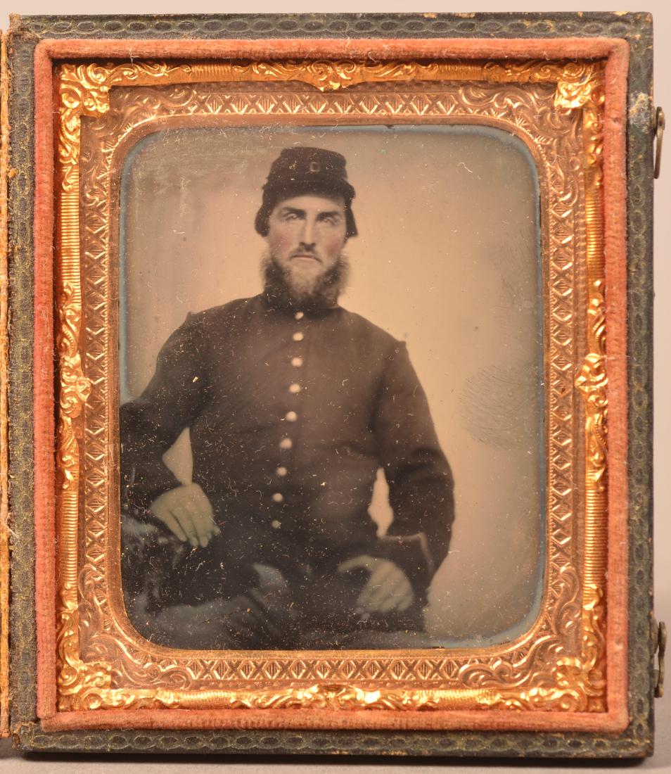 1/6 Plate Ambrotype of a Civil War Soldier. Seated pose: 1/6 Plate Ambrotype of a Civil War Soldier. Seated pose in uniform. In a patriotic embossed leatherette case. Condition: Good with wear.
