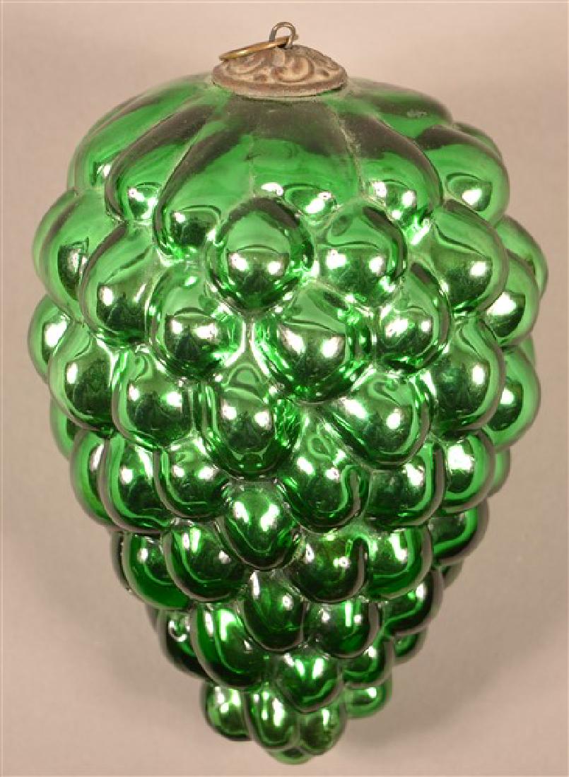 Antique German Green Glass Oval B Cluster of Grapes: Antique German Green Glass Oval B Cluster of Grapes Kugel. Baroque cap. Pictured in "Kugels: An Antique Christmas Obsession" by Joseph Krisky. 5-1/2"l. Condition: Excellent.