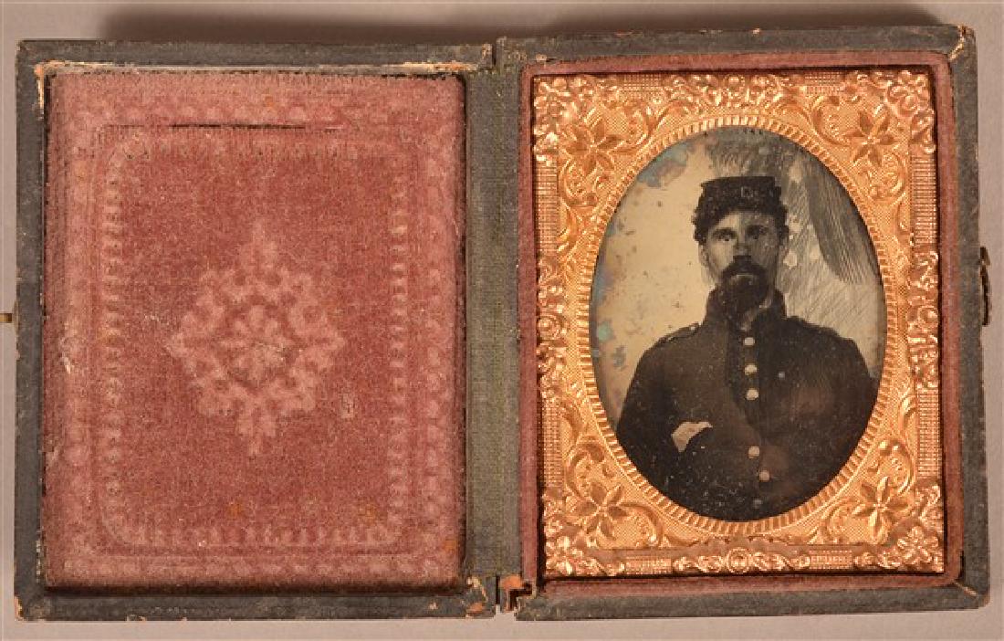 1/9 Plate Ambrotype of a Civil War Soldier. Seated pose: 1/9 Plate Ambrotype of a Civil War Soldier. Seated pose in uniform. In an embossed leatherette case. Condition: Fair with wear and scratches.