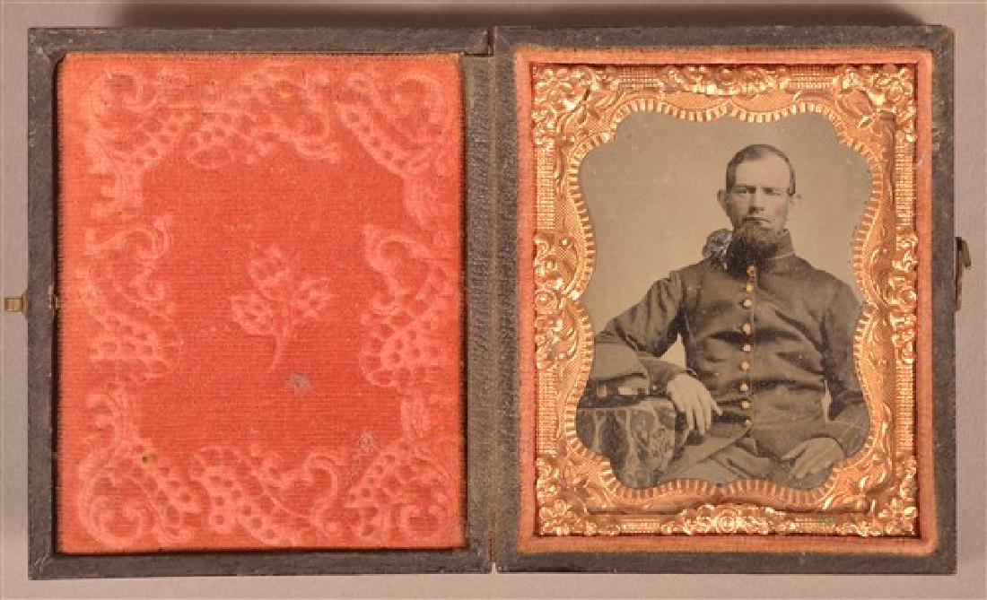 1/9 Plate Ambrotype of a Civil War Soldier. Seated pose: 1/9 Plate Ambrotype of a Civil War Soldier. Seated pose in uniform. Leatherette case. Condition: Good with wear, scrapes and corrosion.
