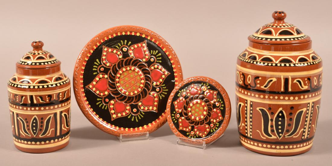 Four Pieces of Contemporary Pottery.: Four Pieces of Contemporary Pottery. Two Nolde Forest canisters, tallest 9"h. and Robesonia Redware hot plates, largest 8" diam. Condition: Very good.