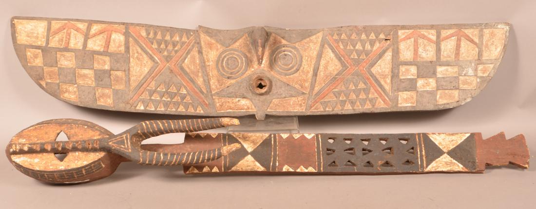 Two African Carved Wood Tribal Masks.: Two Antique/Vintage African Carved Wood Tribal Masks. Polychrome paint decoration. Largest measures 63-1/2"h. Condition: Good with wear, cracks and losses.
