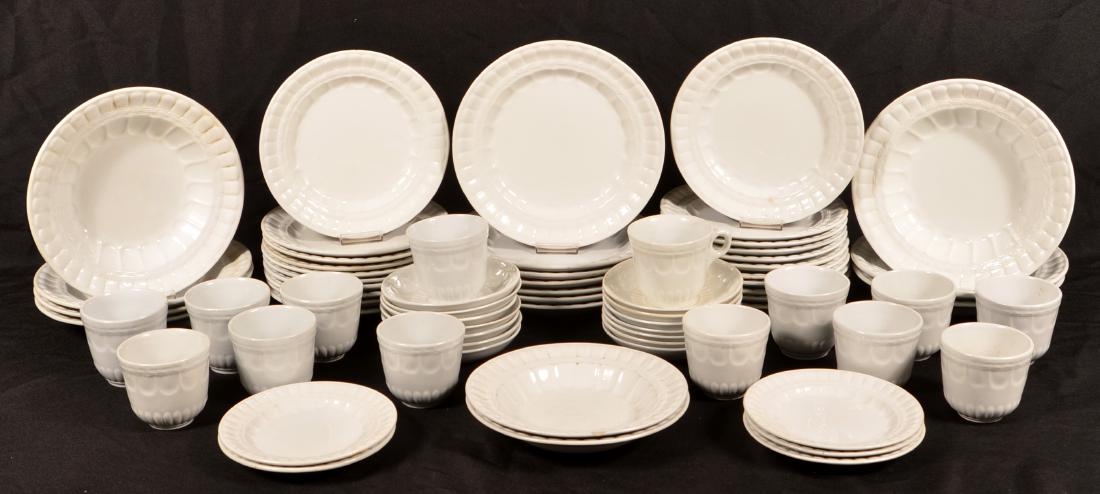 70 Pcs. of Laurel Wreath White Ironstone China.: 70 Pieces of C White Ironstone China. By Elsmore and Forster. Largest plates measure 9-3/4"h. Condition: Good with stains and minor chips.