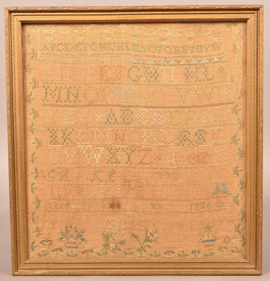 1826 Alphabet Sampler.: 1826 Alphabet Sampler. Name is illegible. Framed, 18-3/4" x 17-1/2" overall. Condition: Good with toning/stain.