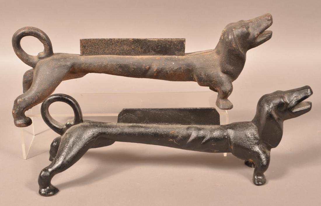 Two Cast Iron Daschund Boot Scrapers.: Two Cast Iron Daschund Boot Scrapers. 21"l. Condition: Good with scattered rust and pitting.
