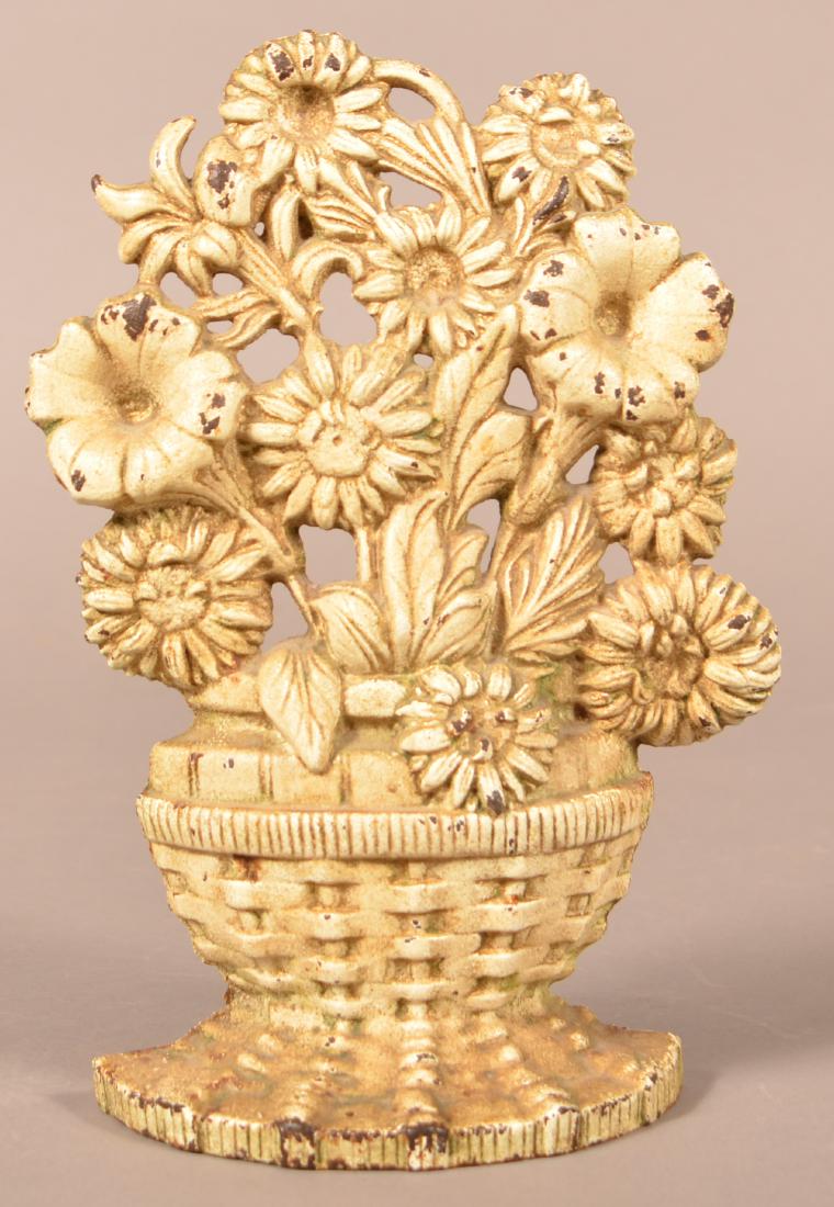 Hubley Cast Iron Basket of Flowers Doorstop.: Hubley Cast Iron Basket of Flowers Doorstop. Ivory paint. 9-1/4"h. Condition: Good with minor wear and light rust.