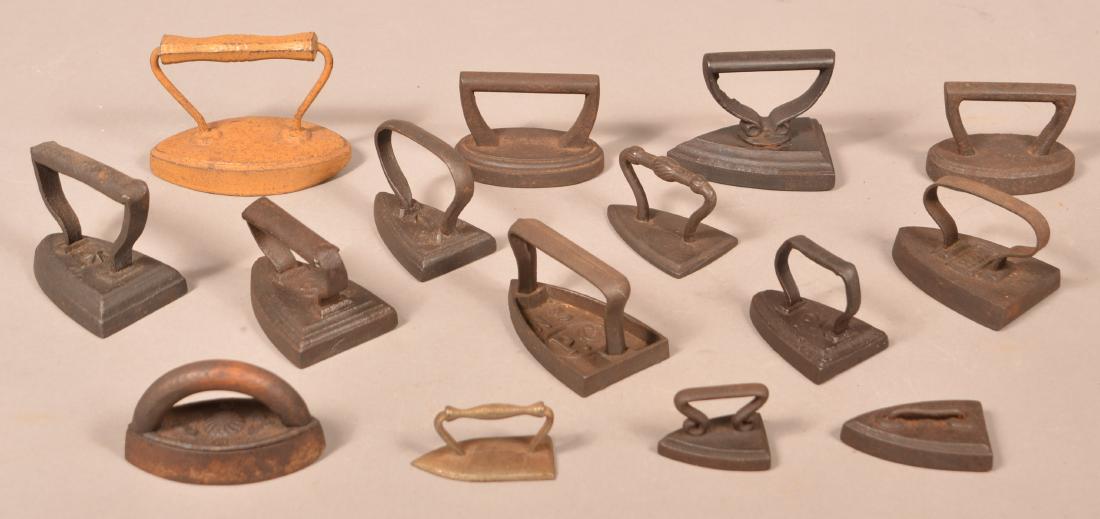 15 Miniature/Small Sadirons and Flat Irons.: 15 Various Antique Miniature/Small Sadirons and Flat Irons. Tallest measures 3-3/4"h. Condition: Good with use wear and scattered rust.