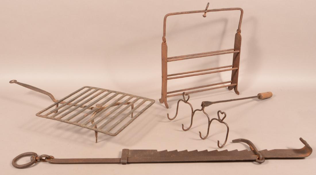 Four Antique Iron Hearth Items.: Four Antique Iron Hearth Items. Trammel measures 55"l. Condition: Good with use wear and scattered rust.