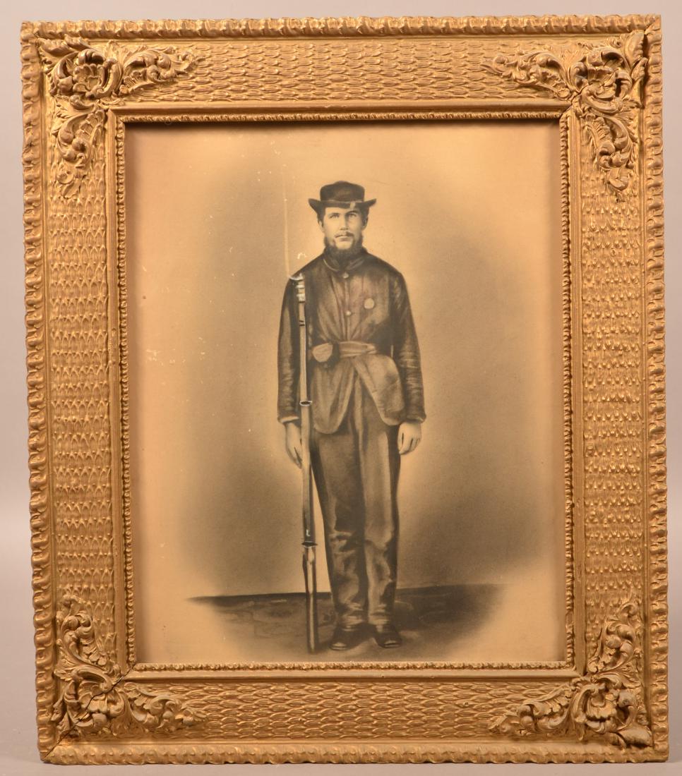 Charcoal Photograph of a Civil War Soldier.: Charcoal Photograph of a Civil War Soldier. Holding a musket with Bayonet. 19-1/2" x 15-1/2". Framed. Condition: Good with toning and minor insect damage.