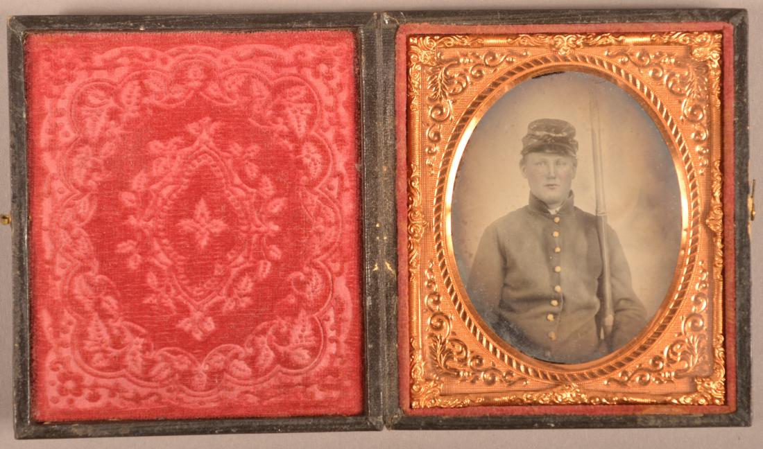 1/6 Plate Ambrotype of a Civil War Soldier.: 1/6 Plate Ambrotype of a Civil War Soldier. In uniform holding a musket. Condition: Good with wear.