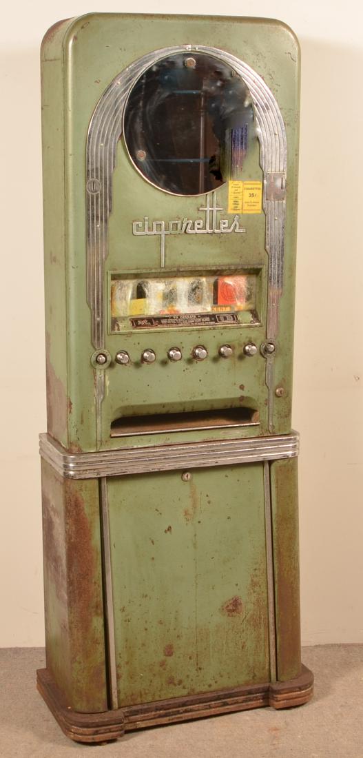 Rowe Art Deco Floor Model Cigarette Machine.: Rowe Art Deco Floor Model Cigarette Vending Machine. 62"h. x 24-1/4"w. x 12"d. Condition: Fair with wear, rust and pitting. Machine is locked with no keys.