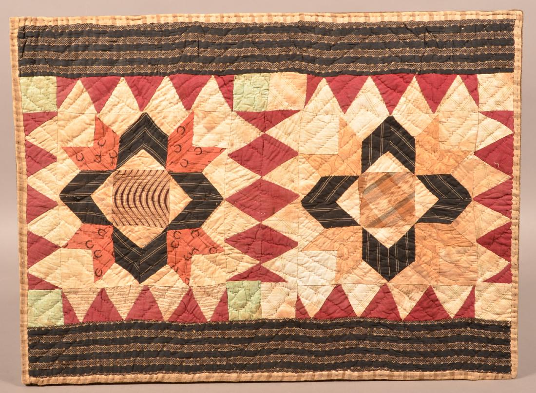 Antique Geometric Pattern Patchwork Crib Quilt.: Antique Geometric Pattern Patchwork Crib Quilt. Mounted on a wood frame, 19-1/4" x 26-1/4". Condition: Good with stains.
