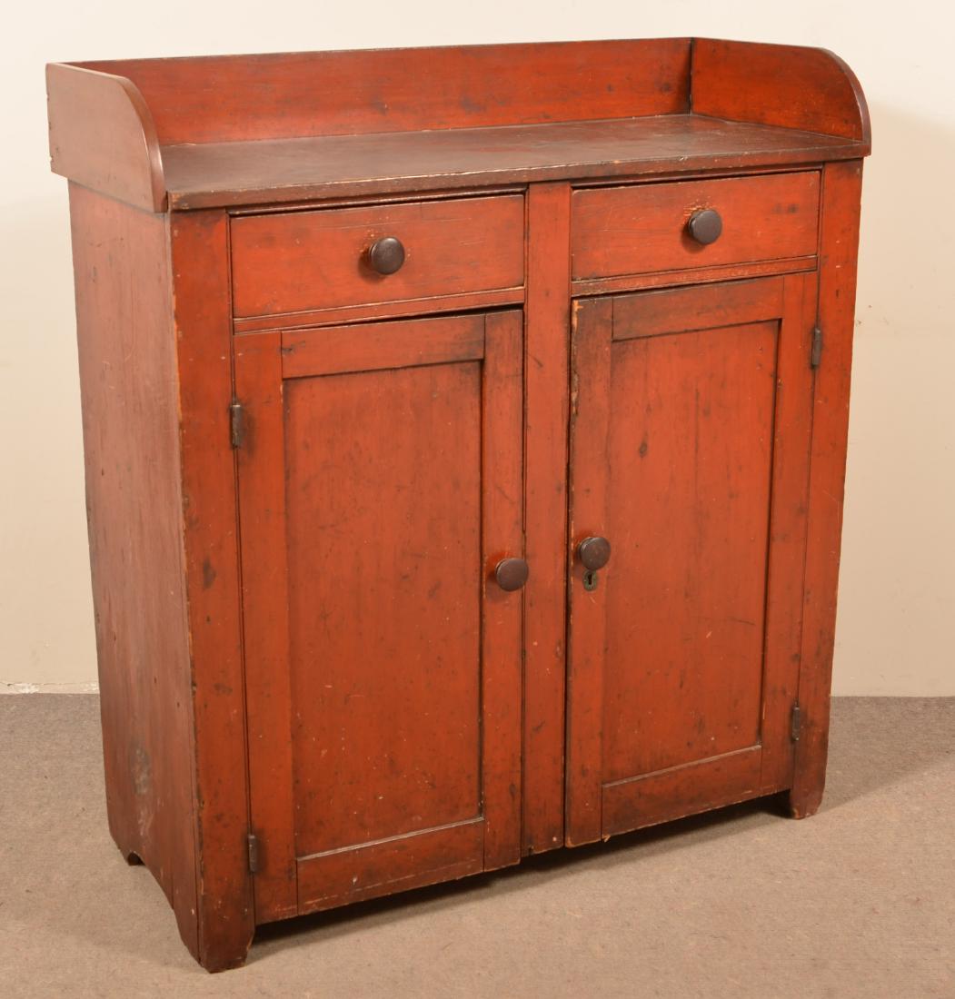 PA Softwood Jelly Cupboard with Old Red Paint.: Pennsylvania Softwood Jelly Cupboard with Old Red Paint. Dovetailed splash-back, two split dovetailed upper drawers, two lower paneled doors, interior shelves and arched cut-out feet. 48"h x 43-1/2"w