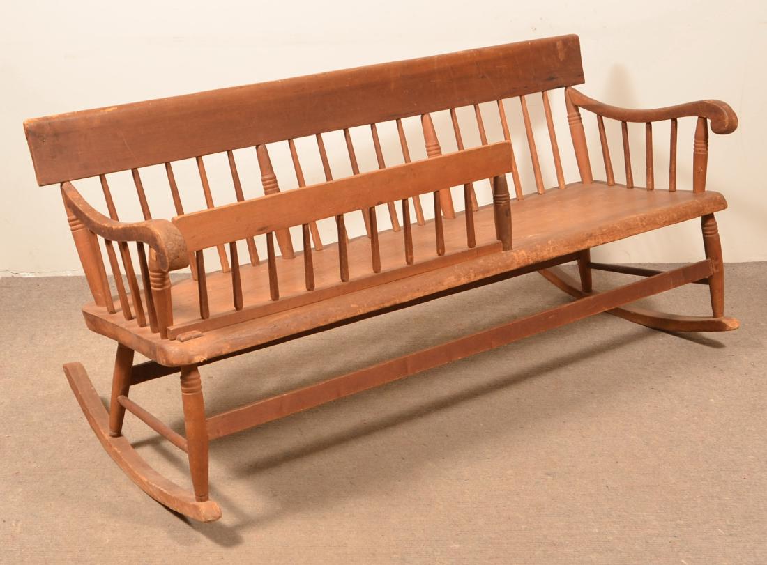 Pennsylvania 19th Century Nanny Rocker.: Pennsylvania 19th Century Nanny Rocker. Spindleback with plank seat and scrolled arms. 29"h. x 61-1/2"l. Condition: Good with wear.