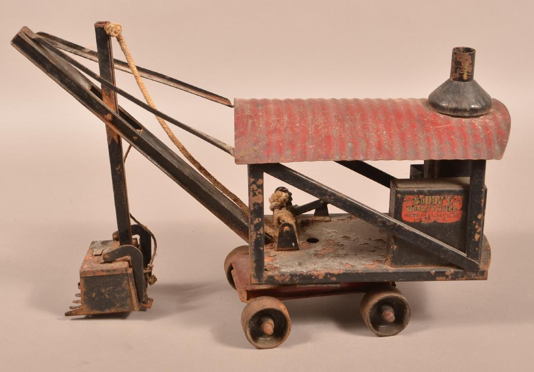 Buddy L Pressed Steel & Cast Iron Steam Shovel.: Buddy L Pressed Steel and Cast Iron Steam Shovel Toy. Circa. 1920's. 21"l. Condition: Fair with rust and wear.