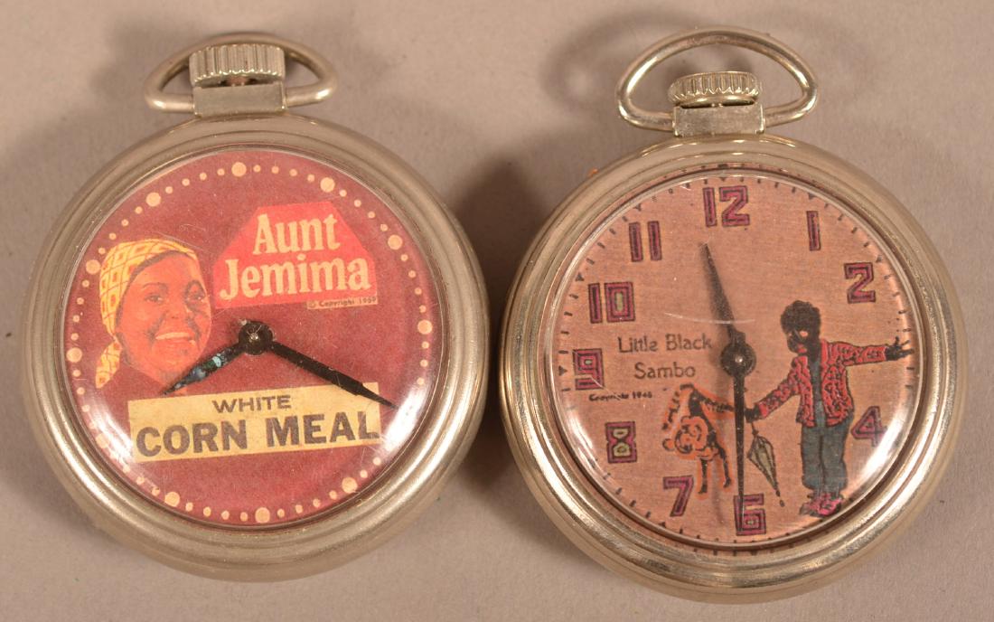 Two Vintage Black Americana Pocket Watches.: Two Vintage Black Americana Pocket Watches. "Aunt Jemima White Corn Meal, Copyright 1959" and Little Black Sambo Copyright 1949. Both with paper dials and movements marked "Made in U.S.A.". Cases meas