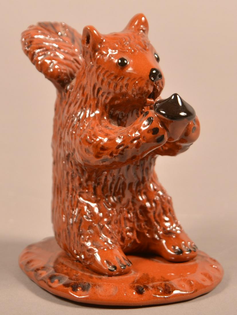 Breininger Redware Pottery Squirrel With Acorn.: Breininger Redware Pottery Squirrel With Acorn. A standing squirrel holding an acorn. Marked: Breininger Pottery Robesonia, PA Nov. 16, 1998. 3-1/4” x 3-3/4” x 4-1/2”. Condition: Very good.