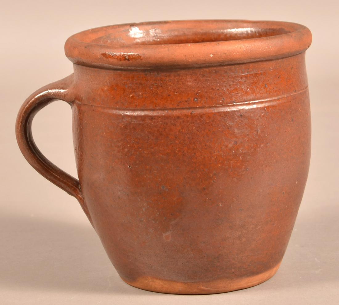 Glazed Redware Apple Butter Jar Attributed to Henry: Glazed Redware Apple Butter Jar Inscribed "HF". Attributed to Henry Fair pottery. Bulbous form with tooled body, rounded rim and applied loop handle. 6-1/2"h. Condition: Good with upper rim chip.