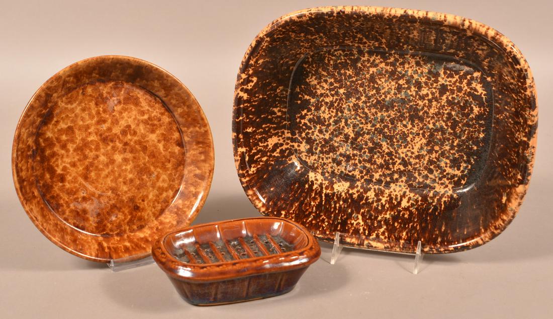 Three Pieces of Rockingham Glazed Yellowware.: Three Pieces of Rockingham Glazed Yellowware. Loaf dish, 13-1/2"w., plate, 9" diam., and a soap dish, 6-3/4"w. Condition: Very good with minor wear.