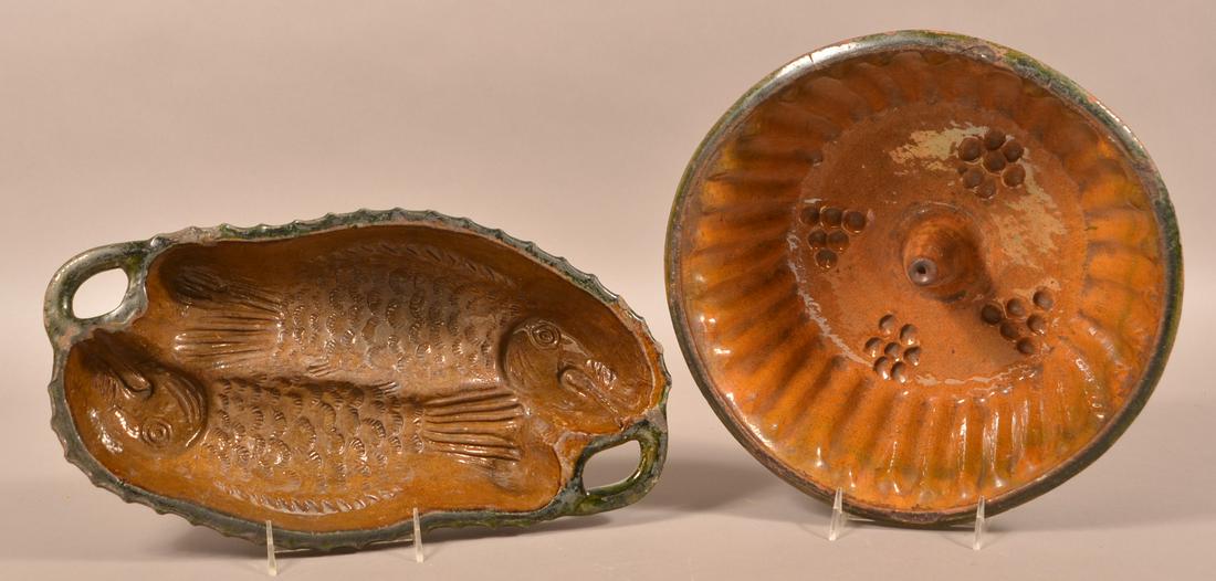 Two Antique French Redware Molds.: Two Antique French Redware Molds. Both with a spinach glaze. Double fish mold, 16"l. and a Turks mold, 12-3/4" diam. Condition: Both have chips and lines.