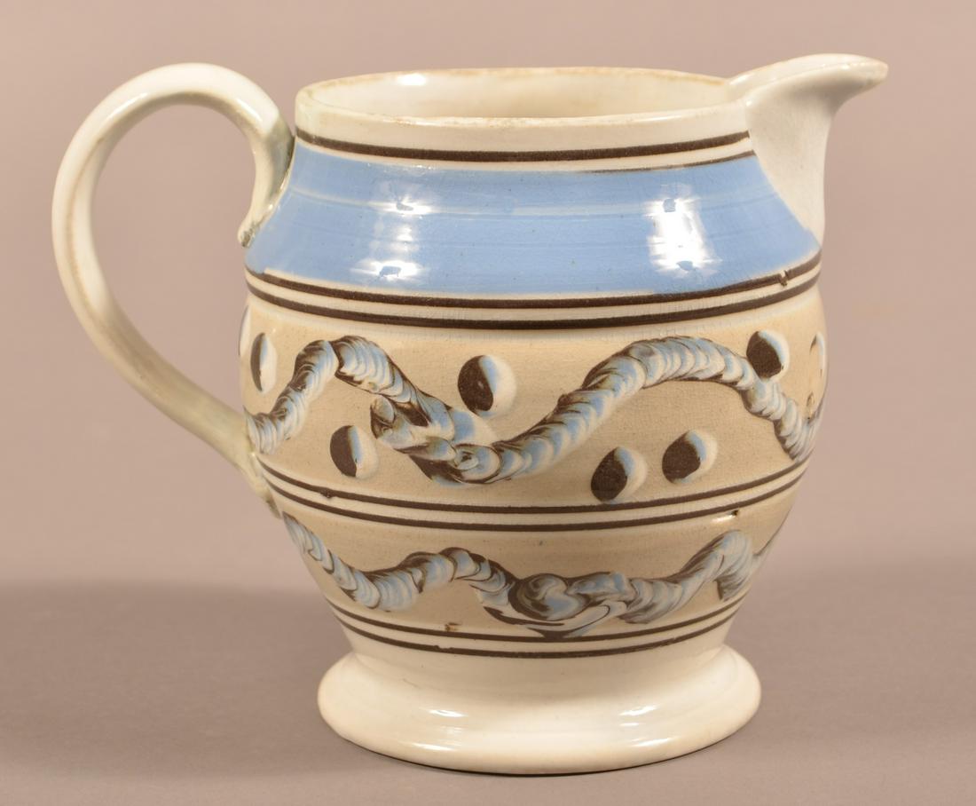 Earthworm and Cat's Eye Mocha decorated china Pitcher.: Earthworm and Cat's Eye Mocha Decorated China Pitcher. Blue and brown bands. 6"h. Condition: Repaired handle and rim.