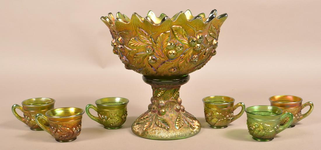 Northwood Green Carnival Glass Acorn Burrs Punch Set.: Northwood Green Carnival Glass Acorn Burrs Punch Set. Punch bowl with pedestal base and six cups. 11"h. 11-1/2" diam. Condition: Good.