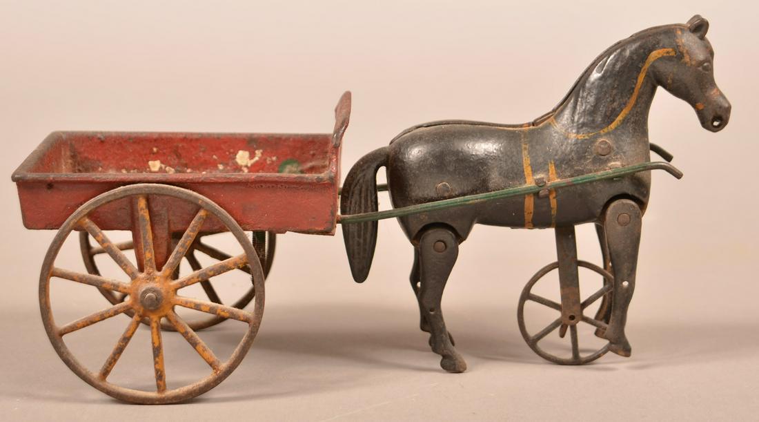 Ives Cast Iron Walking Horse with Victor Cart Pull Toy.: Ives Cast Iron Walking Horse with Victor Cart Pull Toy. Circa. 1890. 9-1/2"l. Condition: Good with use wear.