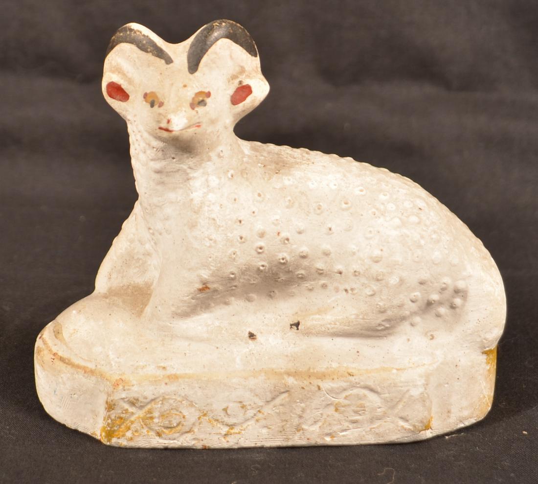 Pennsylvania 19th Century Chalkware Reclining Ram.: Pennsylvania 19th Century Chalkware Reclining Ram. Hollow cast body, painted features and rectangular platform base. 4"h. x 4-1/4"l. Condition: Good with minor wear.