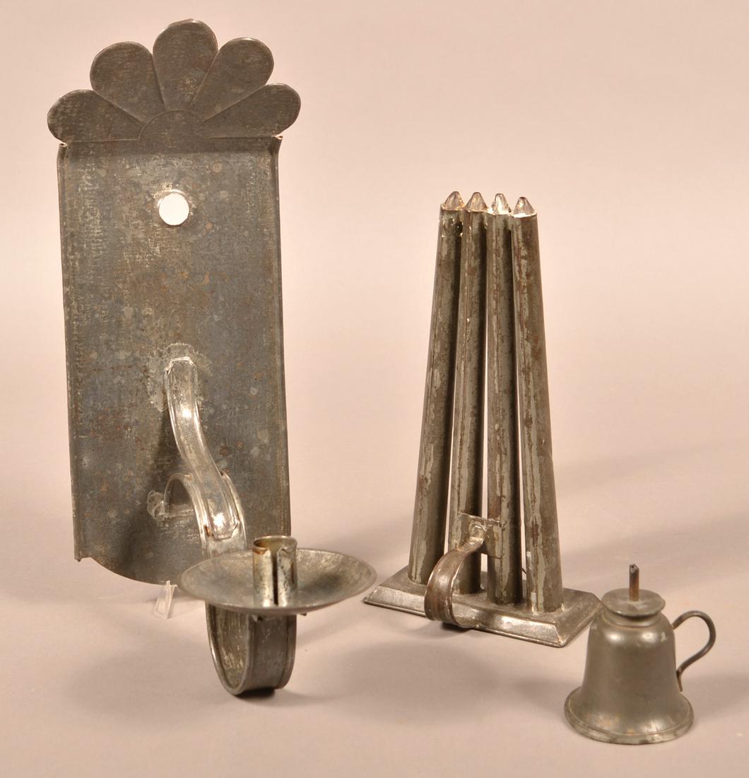 Three Tin and Pewter Lighting Devices.: Three Tin and Pewter Lighting Devices. Candle Sconce Measures 14"h. Condition: Good with minor dents and wear.